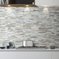 A waterproof and heat-resistant backsplash made of rectangular wood-look PVC tiles in mixed light beige, gray, and white tones, installed as kitchen and bathroom backsplash, or serve as accenting an interior wall.
